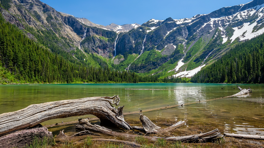 Avalanche Lake and mountain waterfalls in Glacier National Park